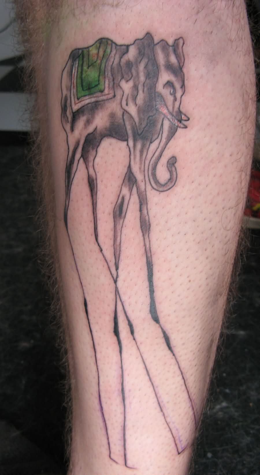 Black Ink Dali Elephant Tattoo On Leg Calf By Cassienoble