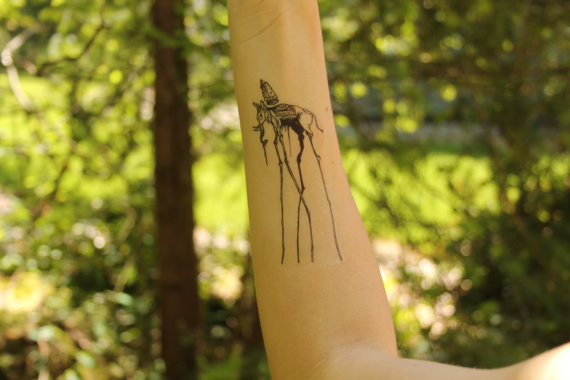 Black Ink Dali Elephant Tattoo On Right Forearm