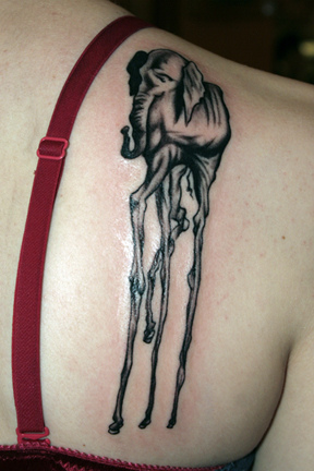 Black Ink Dali Elephant Tattoo On Women Right Back Shoulder