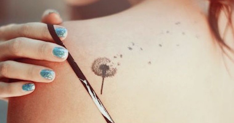 Black Ink Dandelion Tattoo On Women Left Back Shoulder