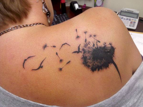 Black Ink Dandelion Tattoo On Women Right Back Shoulder
