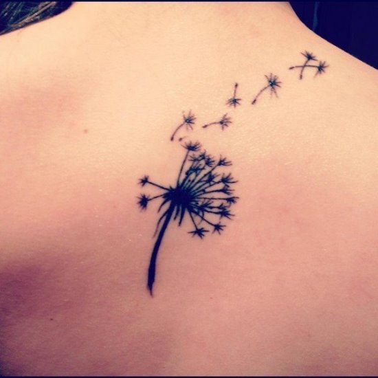 Black Ink Dandelion Tattoo On Women Upper Back