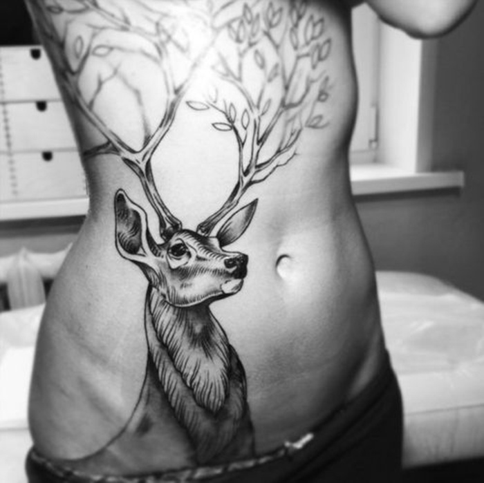 Black Ink Deer Head Tattoo On Right Side Rib