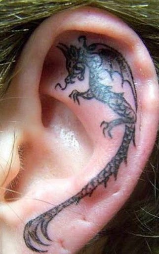 Black Ink Dragon Tattoo On Left Ear
