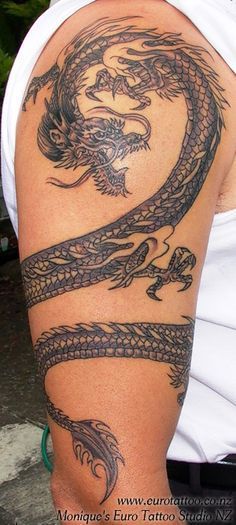 Black Ink Dragon Tattoo On Man Right Upper Arm
