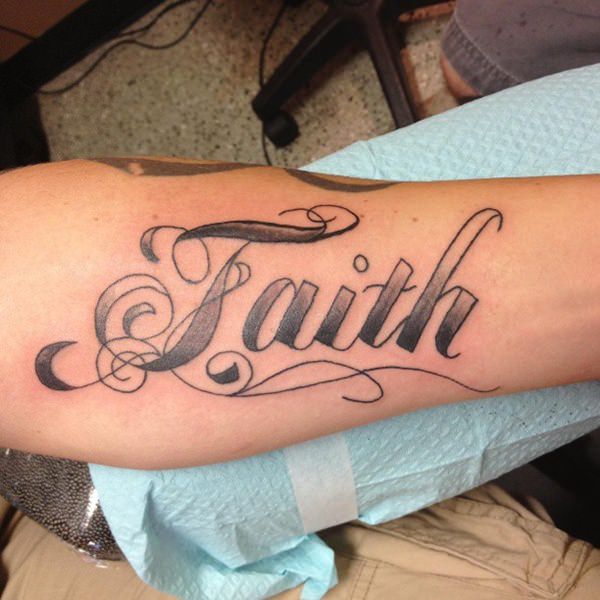 Black Ink Faith Lettering Tattoo On Forearm