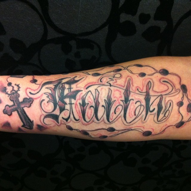 Black Ink Faith Lettering With Cross Tattoo Design For Forearm