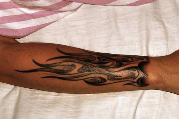 Black Ink Fire And Flame Tattoo On Right Arm