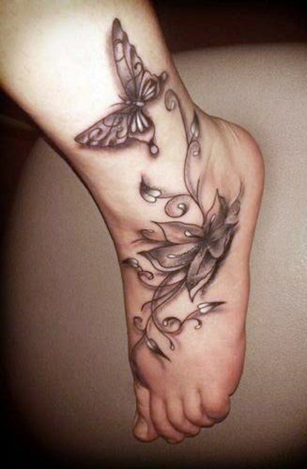 Black Ink Flower With Butterfly Tattoo On Left Foot