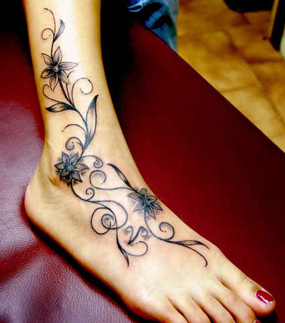 Black Ink Flowers Tattoo On Right Ankle