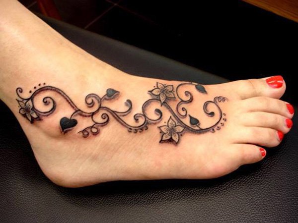 Black Ink Flowers Tattoo On Right Foot