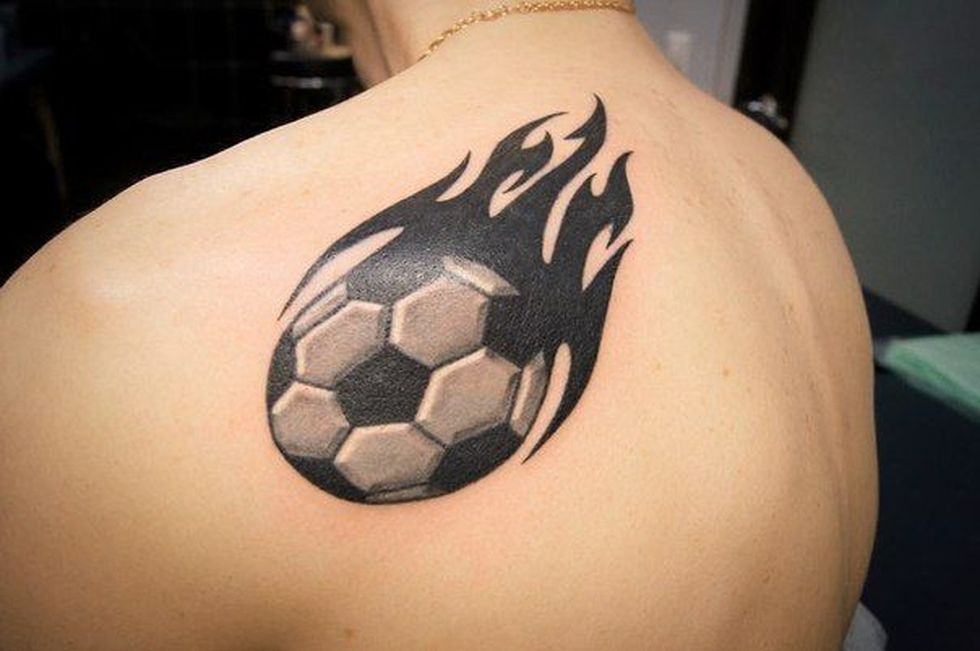 Black Ink Football Tattoo On Left Back Shoulder