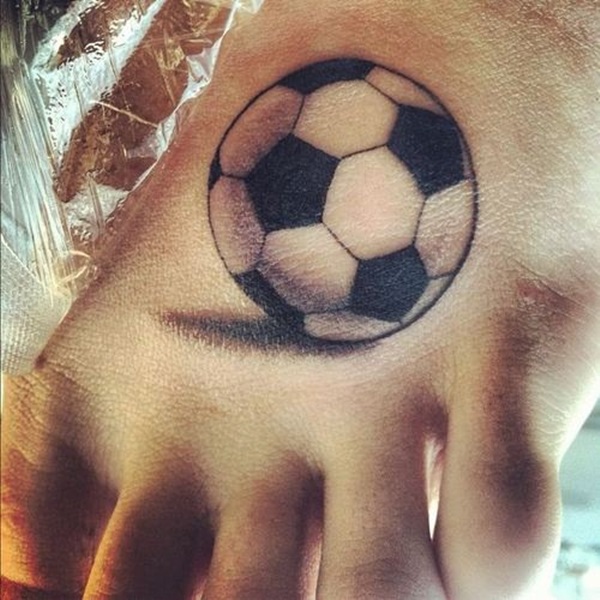Black Ink Football Tattoo On Left Foot
