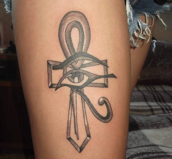 Black Ink Horus Eye With Ankh Tattoo Design For Thigh