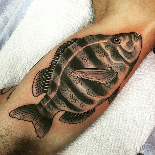 Black Ink Piranha Fish Tattoo On Bicep