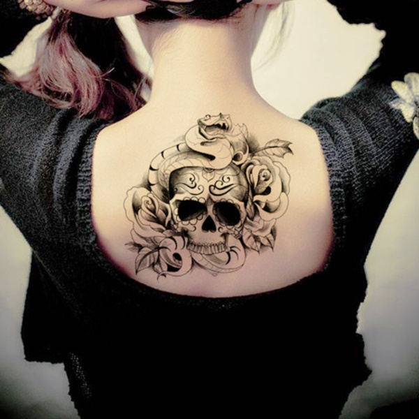 Black Ink Skull With Roses And Snake Tattoo On Women Upper Back