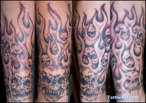 Black Ink Skulls In Fire And Flame Tattoo Design For Sleeve