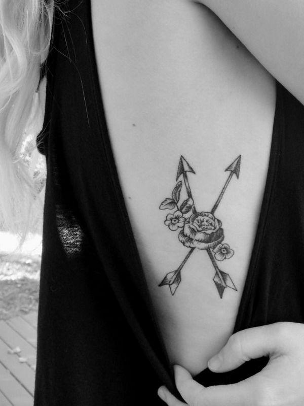 Black Ink Two Arrows With Flowers Tattoo On Girl Right Side Wrist