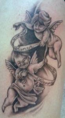 Black Ink Two Baby Angel With Banner Tattoo On Side Rib