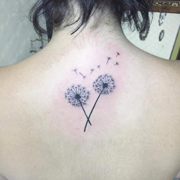 Black Ink Two Dandelion Tattoo On Women Upper Back