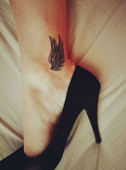 Black Ink Wings Tattoo On Left Ankle