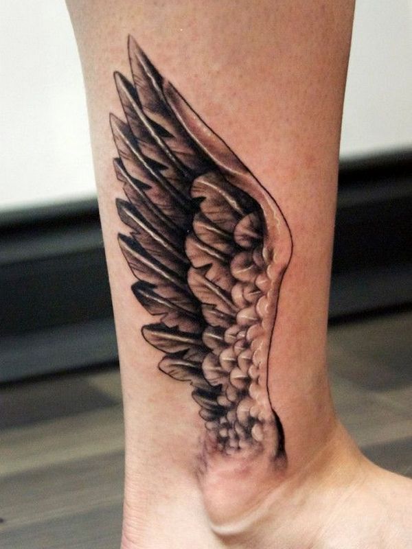 Black Ink Wings Tattoo On Right Ankle
