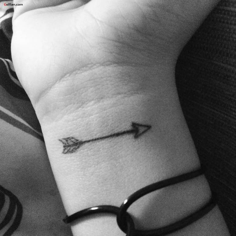 Black Outline Arrow Tattoo On Right Wrist