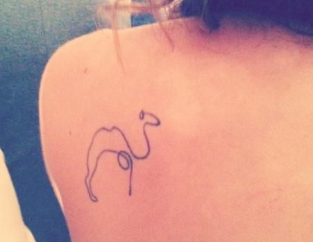 Black Outline Camel Tattoo On Left Back Shoulder