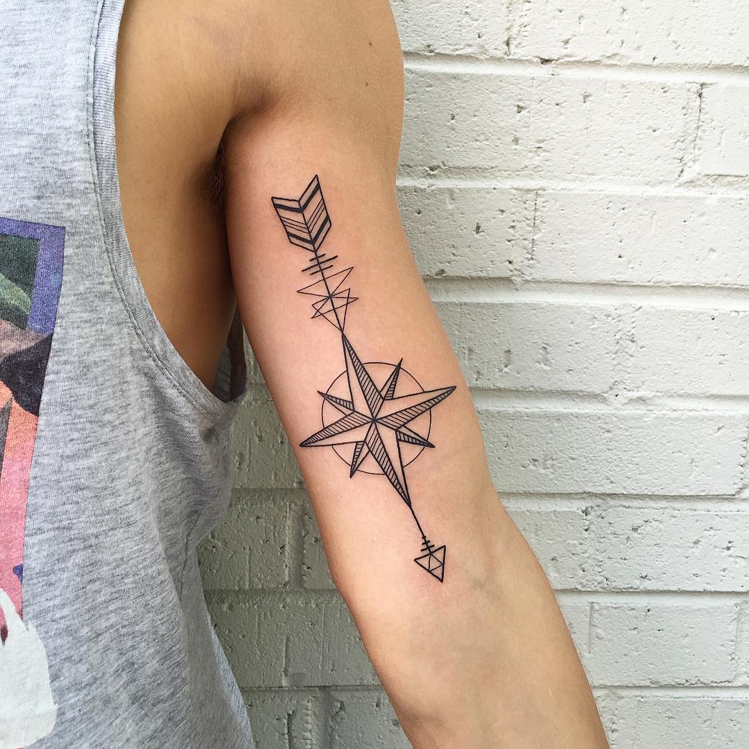 Black Outline Geometric Nautical Star With Arrow Tattoo On Left Bicep