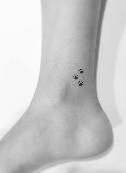 Black Paw Prints Tattoo On Ankle