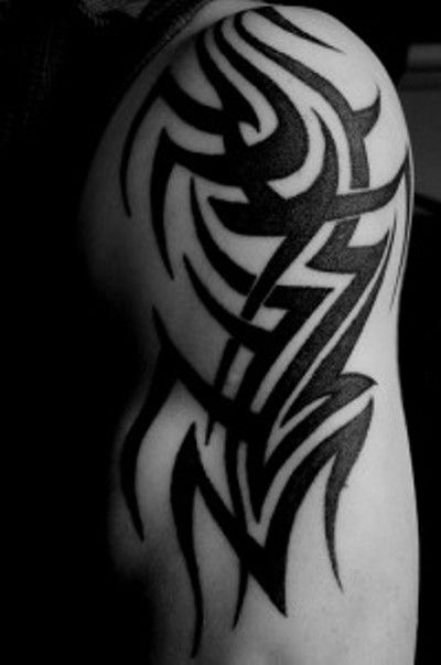 Black Tribal Design Tattoo On Left Upper Arm