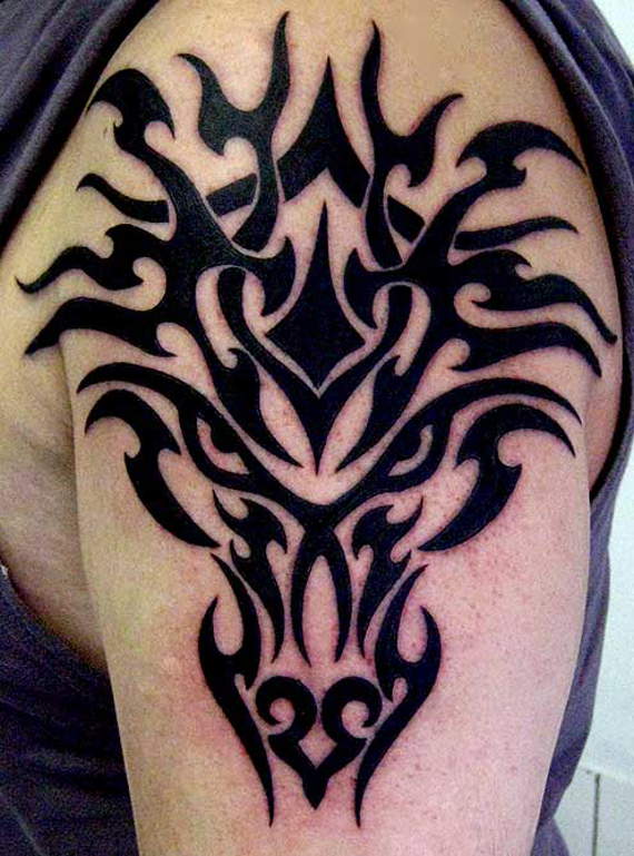 Black Tribal Dragon Head Tattoo On Man Left Upper Arm