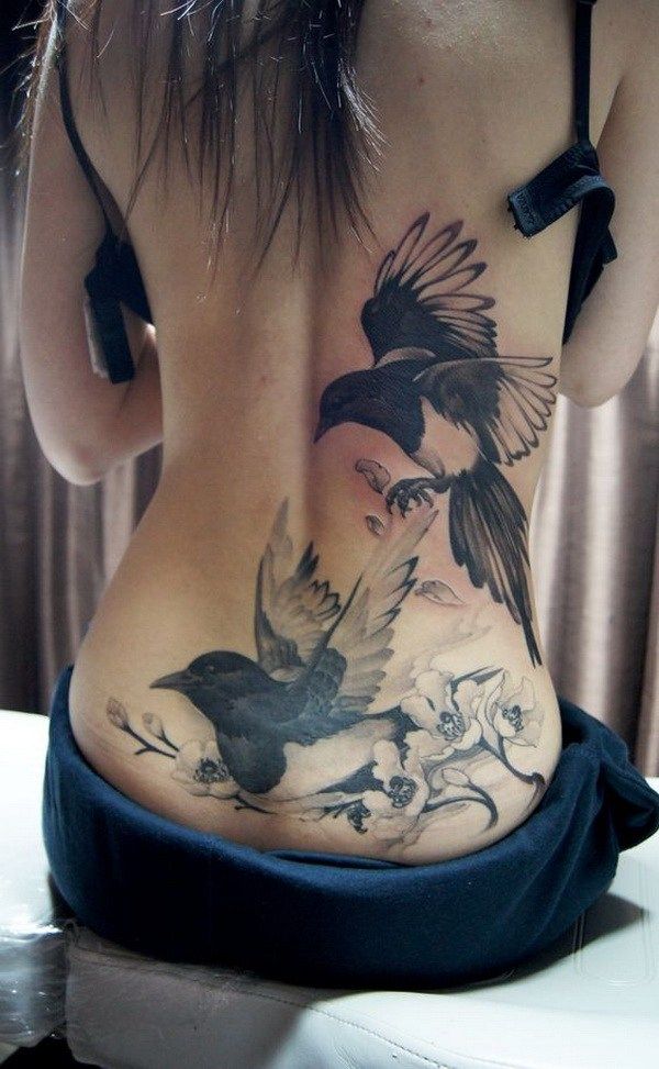 Classic Black And Grey Two Birds Tattoo On Women Lower Back
