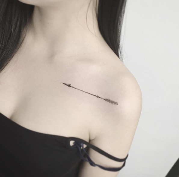 Classic Grey Ink Arrow Tattoo On Women Left Front Shoulder