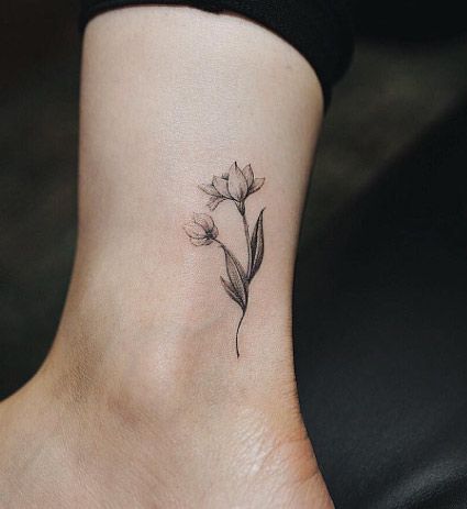 Classic Grey Ink Flowers Tattoo On Left Ankle