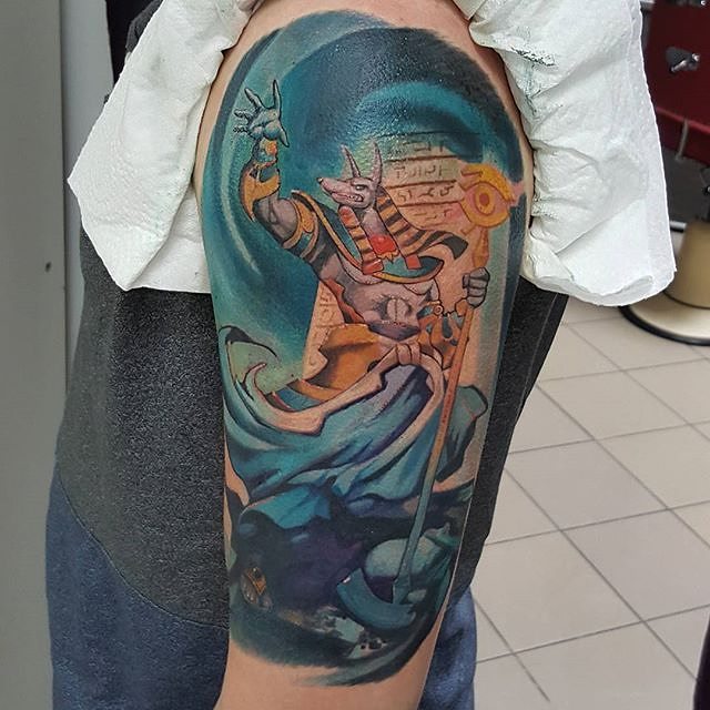 Colorful Anubis Tattoo On Man Left Half Sleeve