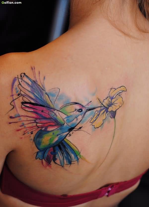 Colorful Aqua Flying Bird With Flower Tattoo On Left Back Shoulder