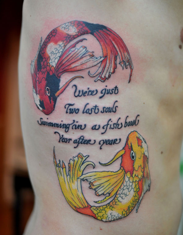 Colorful Attractive Two Fishes Tattoo On Right Side Rib