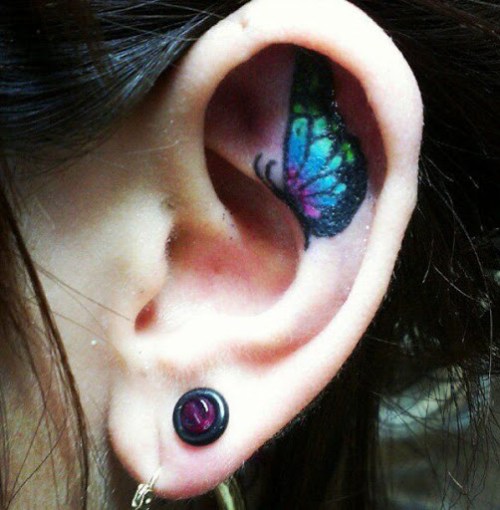 Colorful Butterfly Tattoo On Girl Left Ear