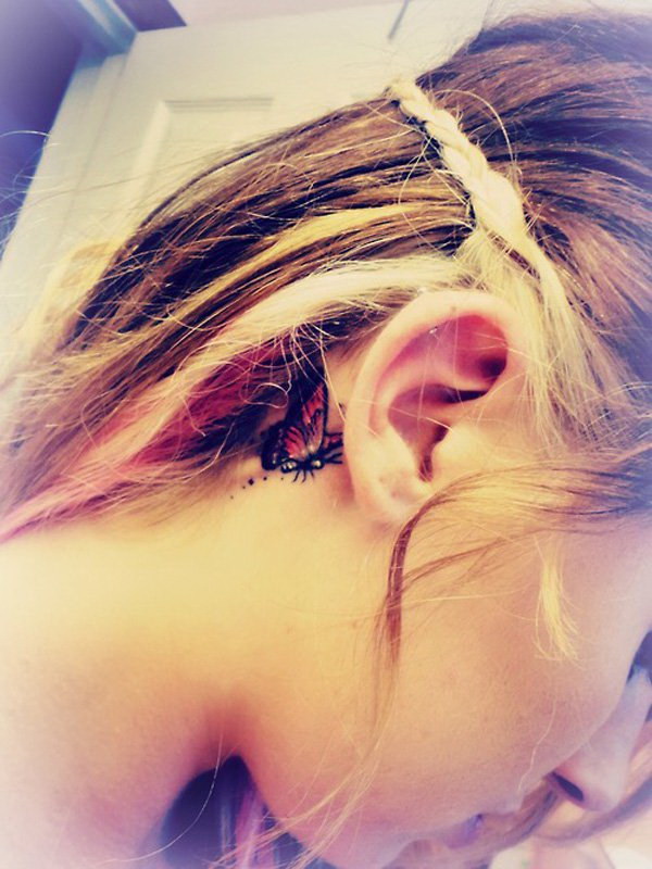 Colorful Butterfly Tattoo On Girl Right Behind The Ear