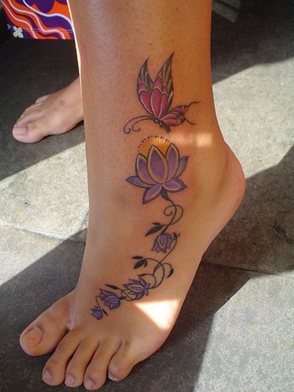 Colorful Lotus Flowers With Flying Butterfly Tattoo On Left Foot