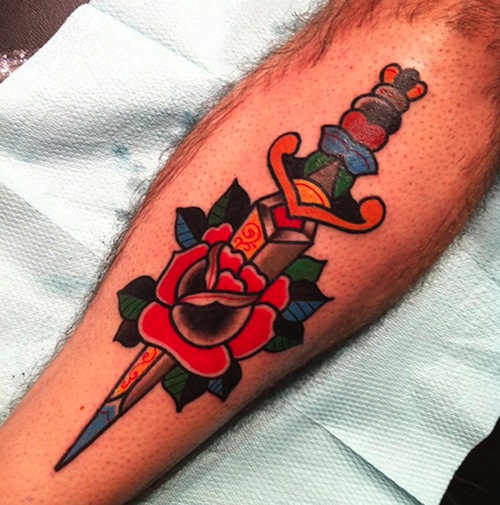 Colorful Traditional Dagger In Rose Tattoo Design For Leg