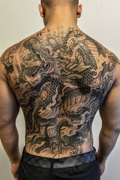 Cool Black Ink Asian Dragon Tattoo On Man Full Back