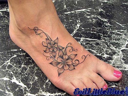 Cool Black Ink Flowers Tattoo On Women Right Foot