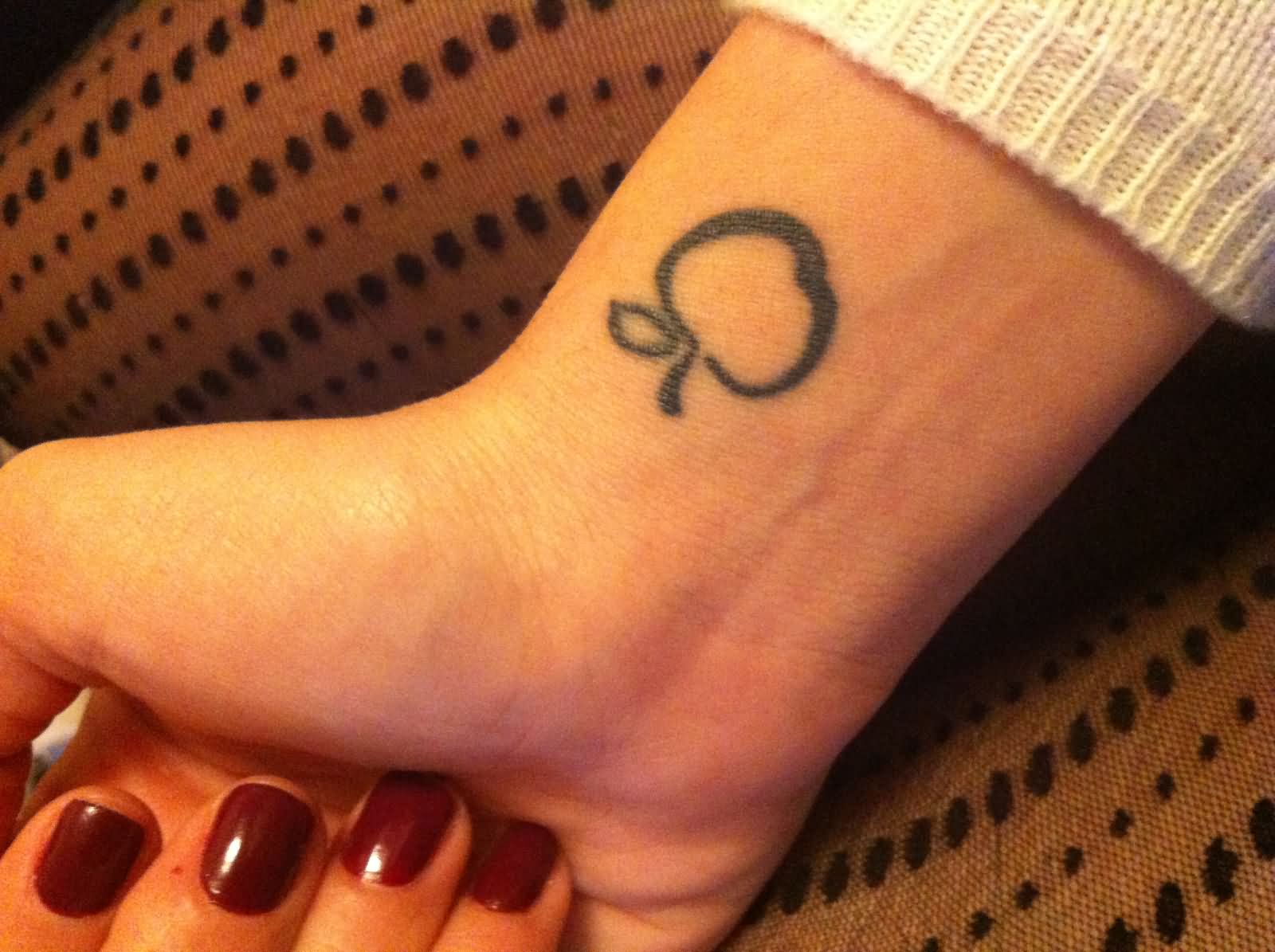 Cool Black Outline Apple Tattoo On Girl Right Wrist