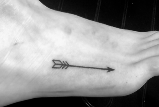 Cool Black Outline Arrow Tattoo On Right Foot