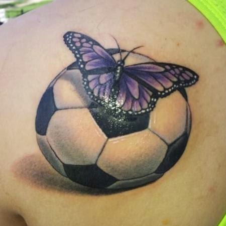 Cool Butterfly On Football Tattoo On Left Back Shoulder