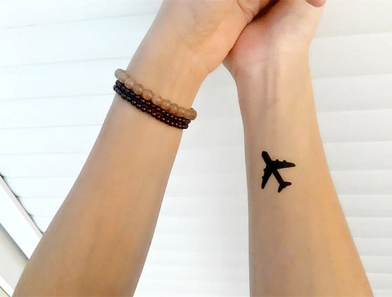 Cool Silhouette Airplane Tattoo On Wrist