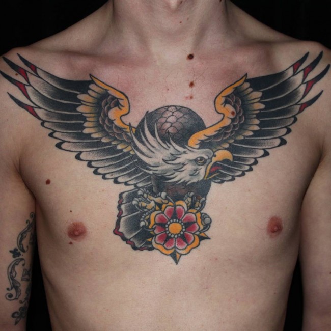Cool Traditional Flying Eagle With Flower Tattoo On Man Chest