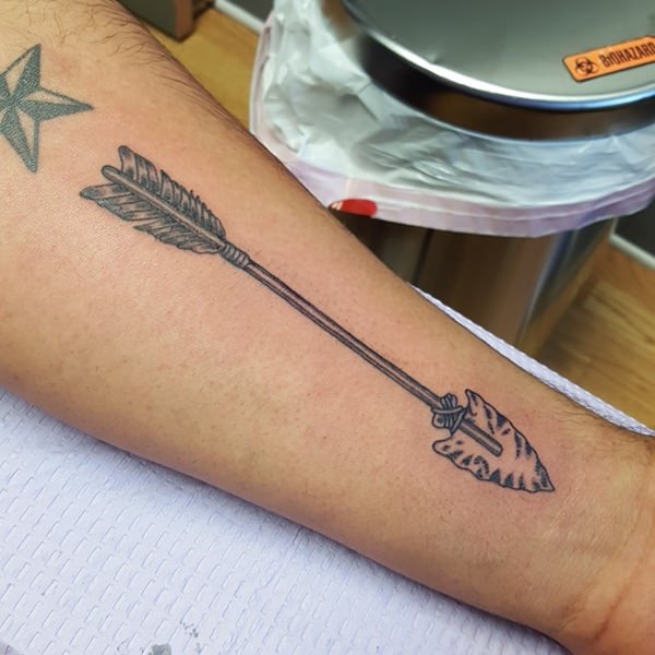 Impressive Black Ink Arrow Tattoo On Left Forearm